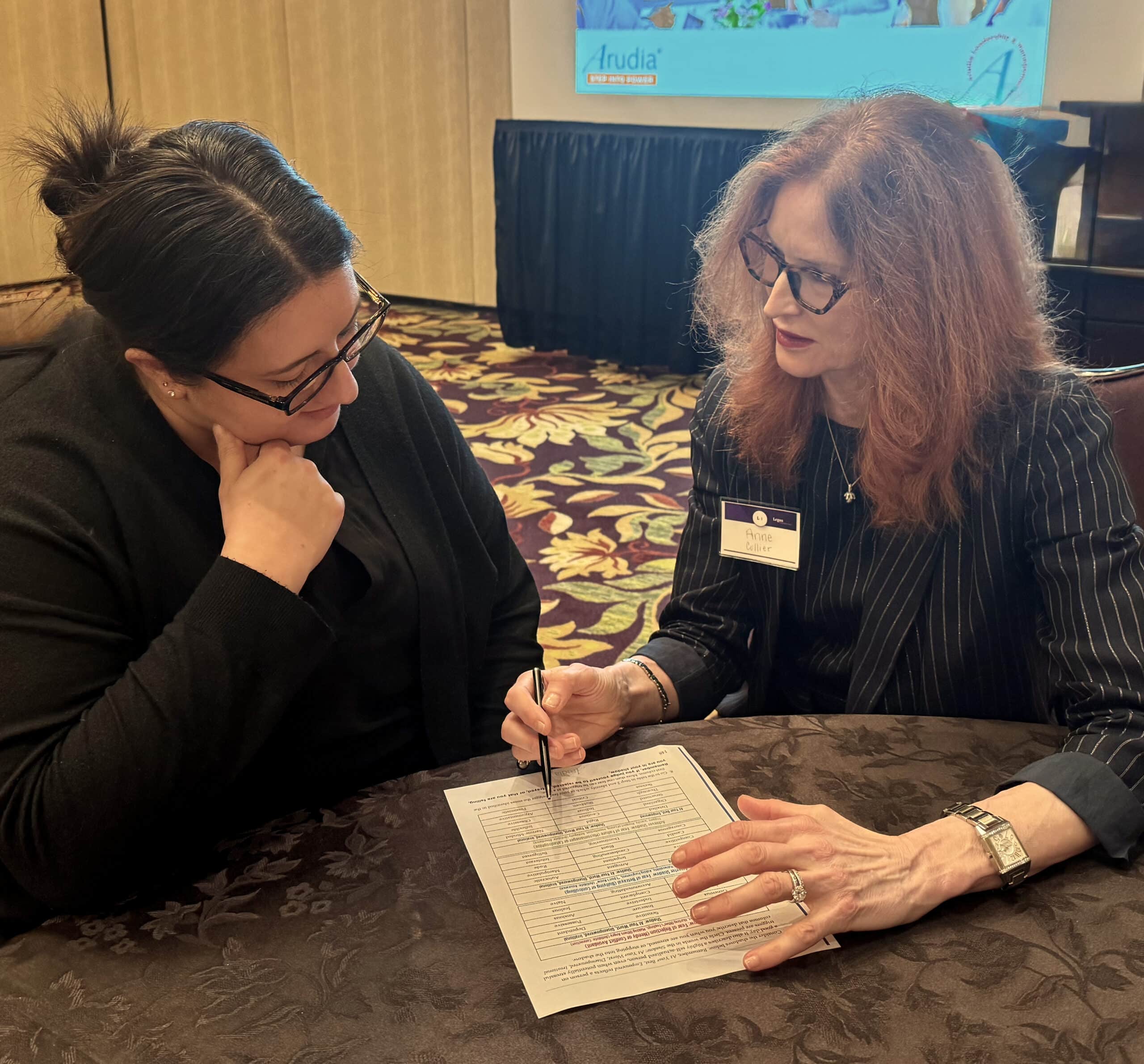 Anne Collier & client go over assessment