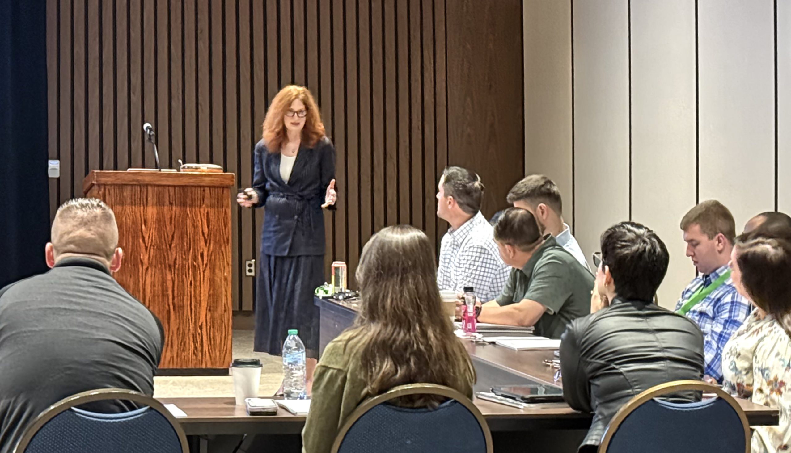 Anne speaking at conference